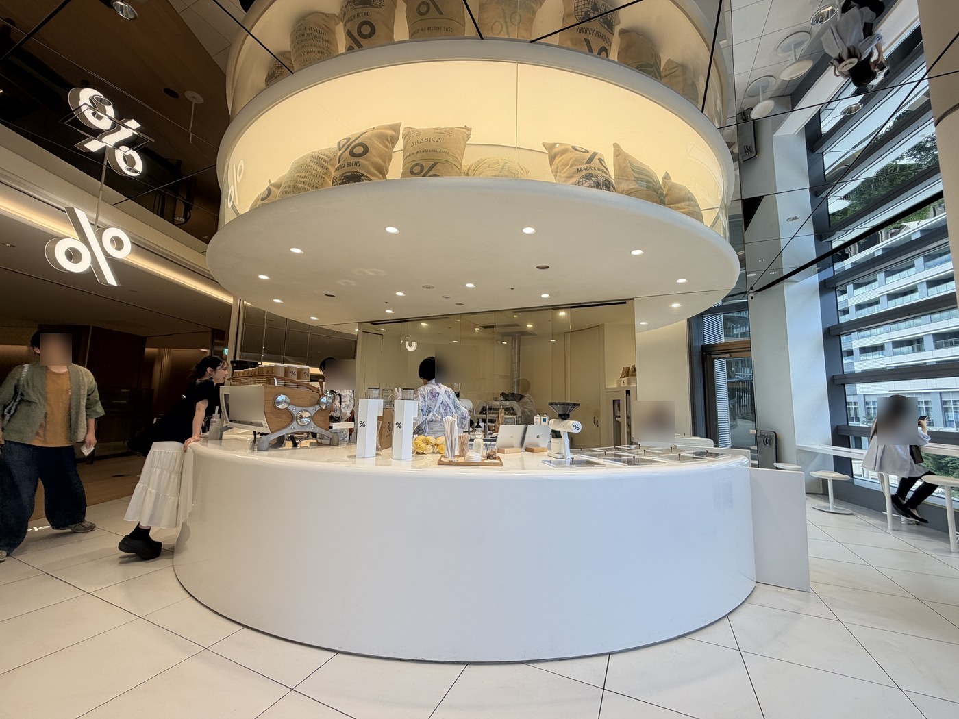 White circular counter of Arabica Tokyo coffee shop at Azabudai Hills