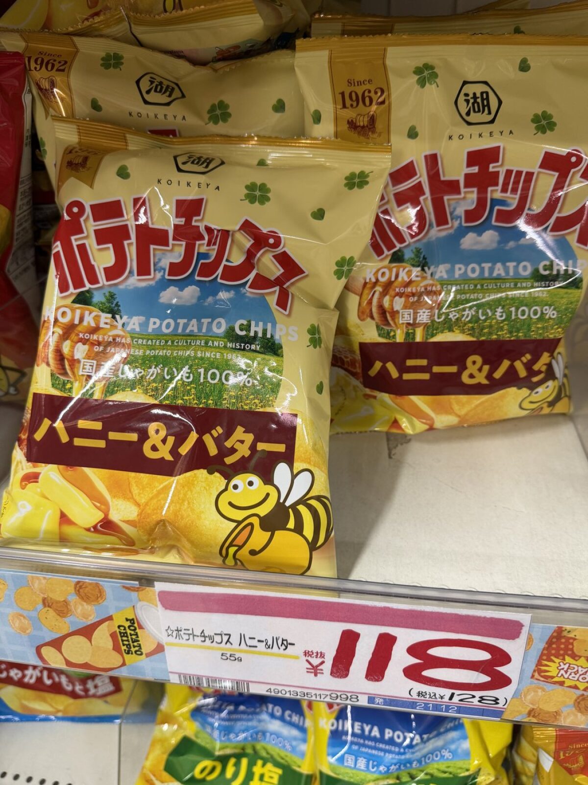 Koikeya honey and butter potato chips with a shelf tag reading 118 yen before tax