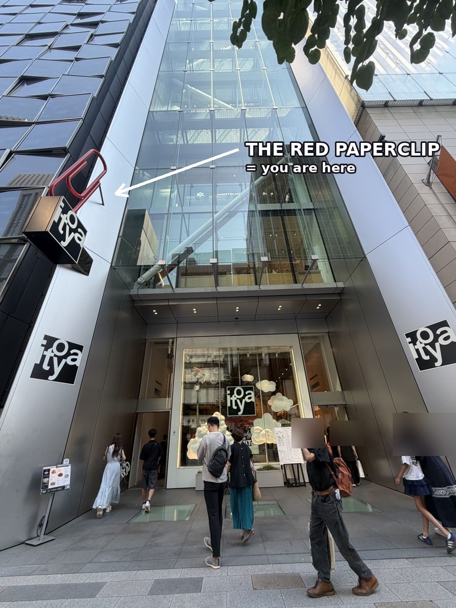 Ginza Itoya storefront with arrow pointing to the red paperclip sign