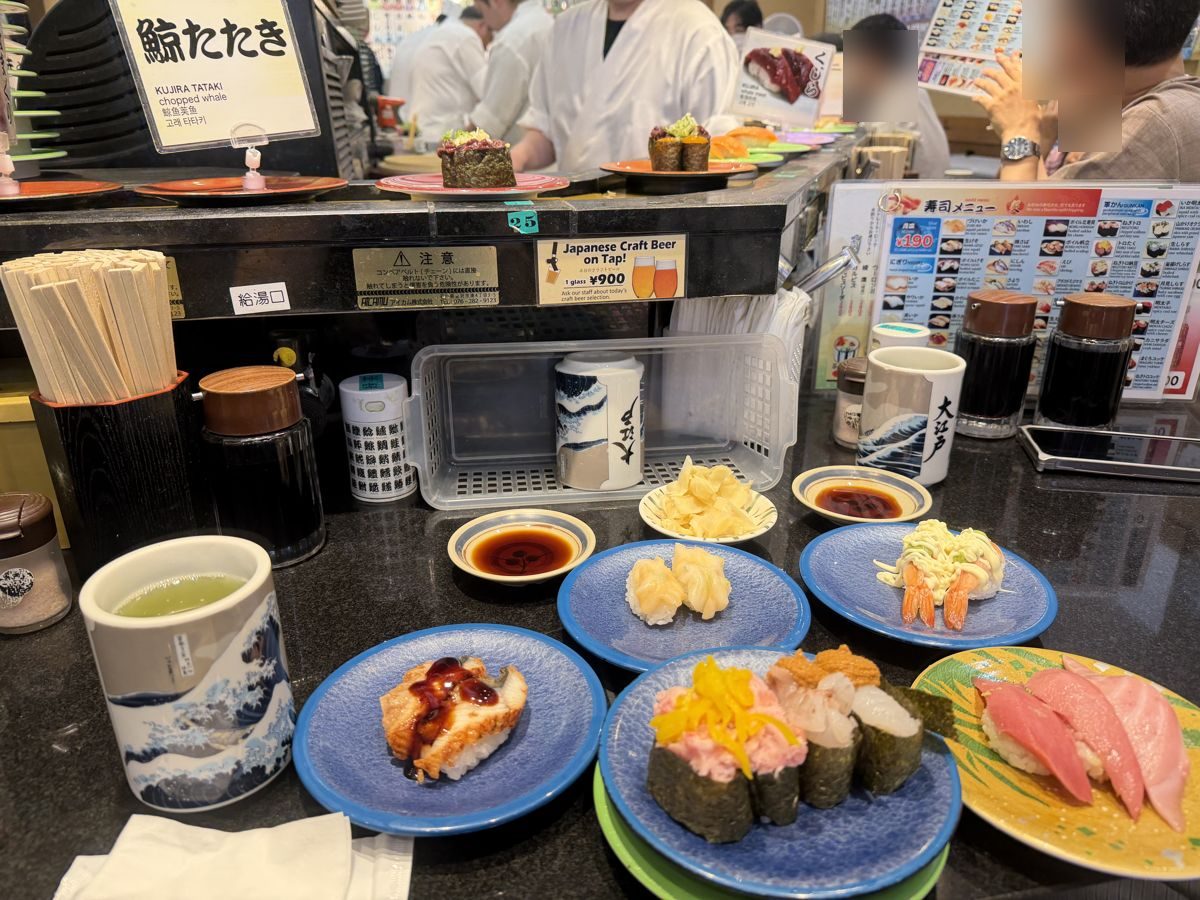 Kaiten sushi conveyor counter with chefs at Oedo Tokyo