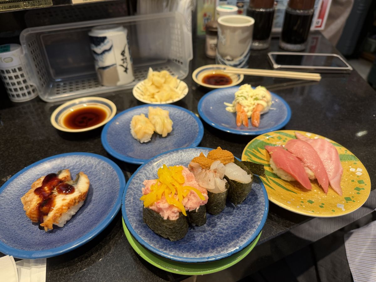 Colorful sushi plates from the conveyor at kaiten sushi Oedo Tokyo