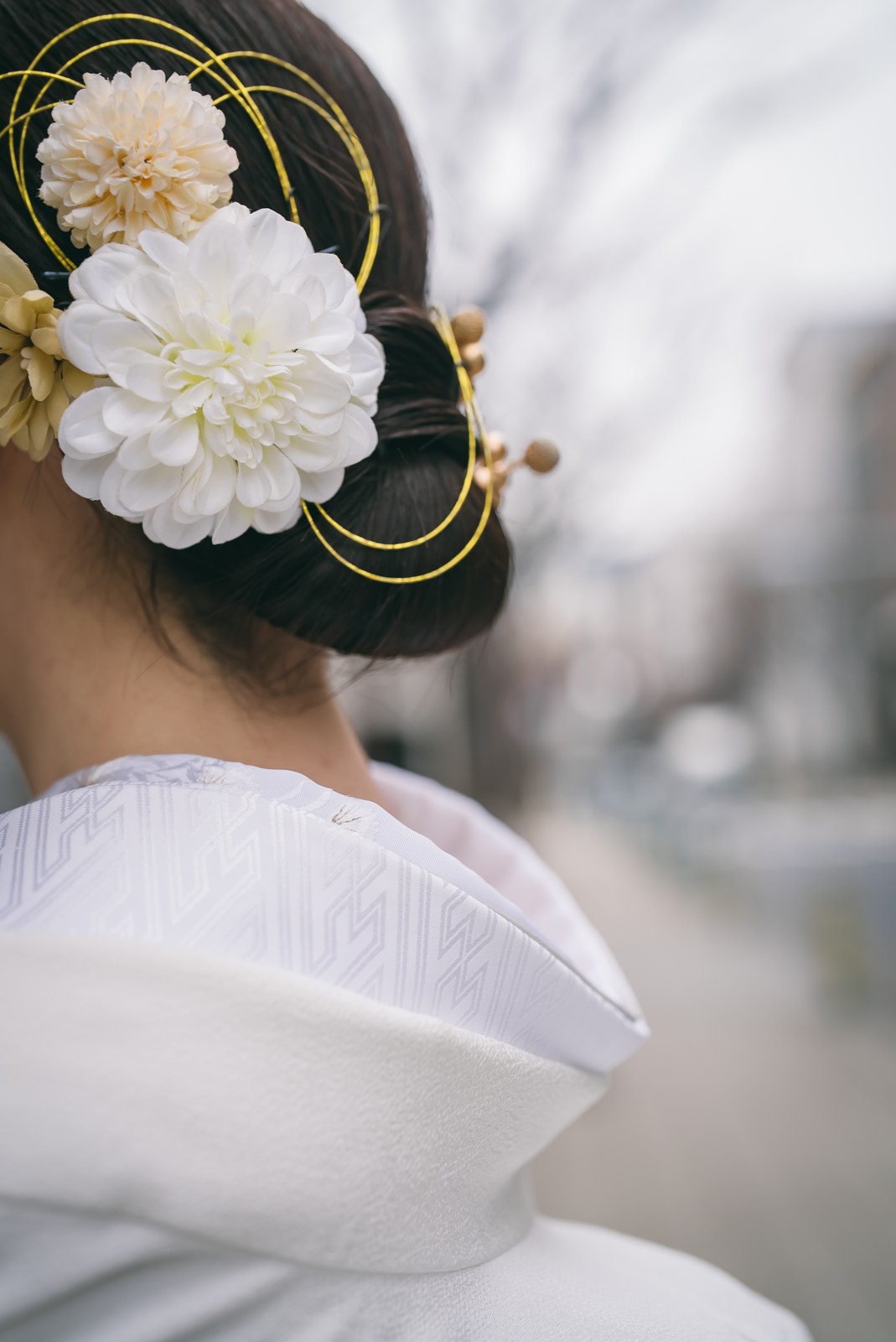Back view of a shiromuku collar and bridal updo with kanzashi