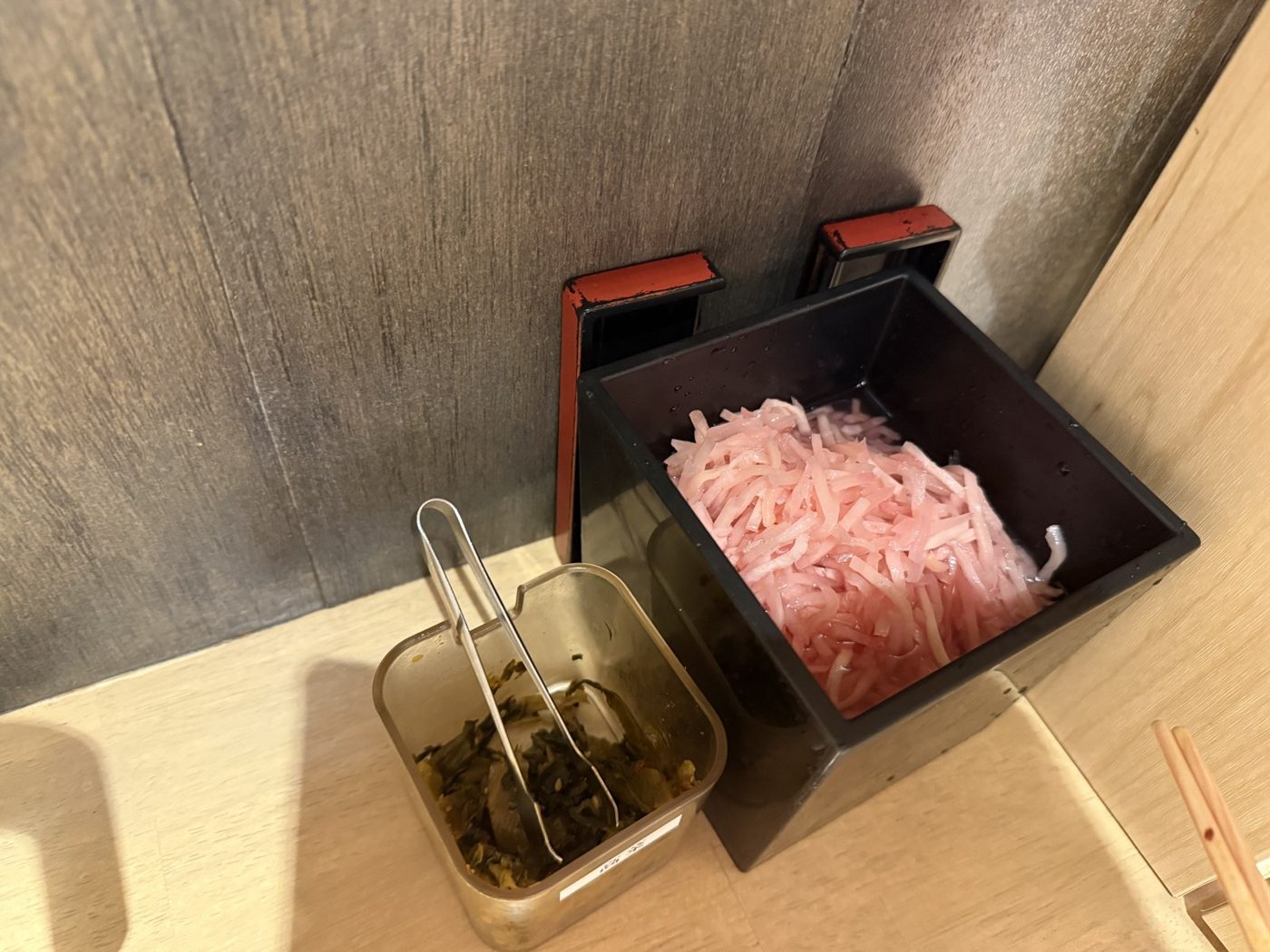 Left: takana. Right: beni-shoga. Tongs in both. Take as much as you like.