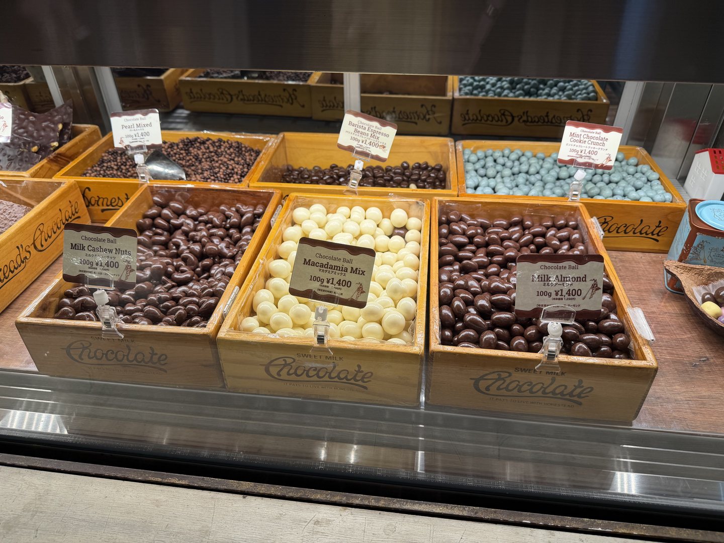 Chocolate covered nuts sold by weight with price cards