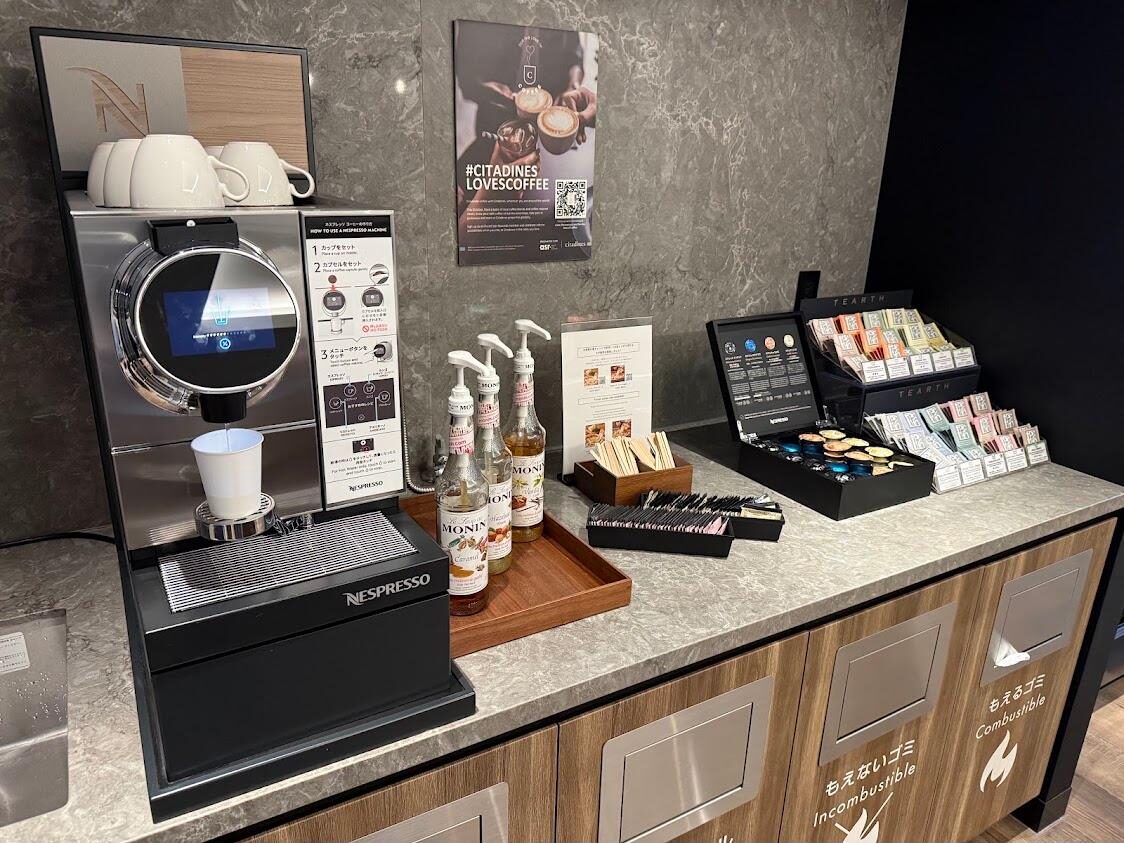 Free Nespresso coffee machine and capsule rack in the lounge at Citadines Harbour Front Yokohama