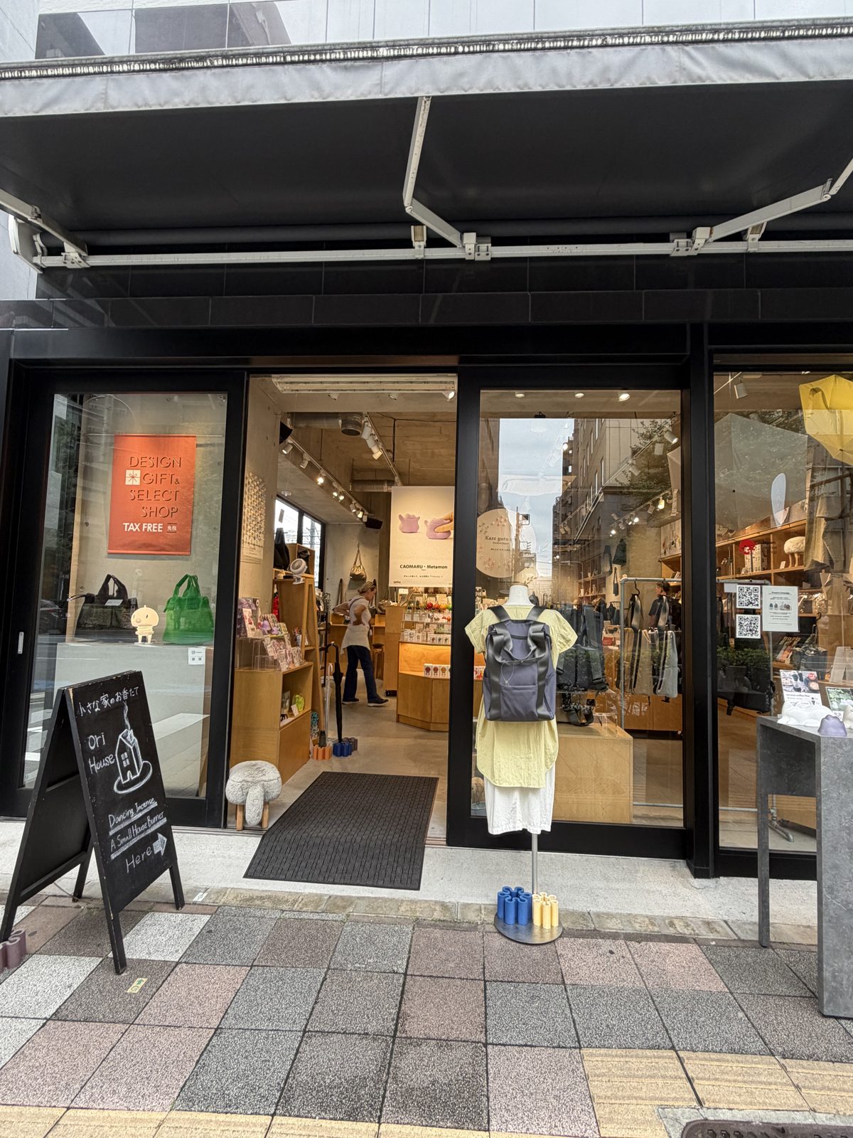 KONCENT design gift and select shop storefront in Kuramae with an open glass door and a mannequin